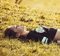 A woman lying down in the field